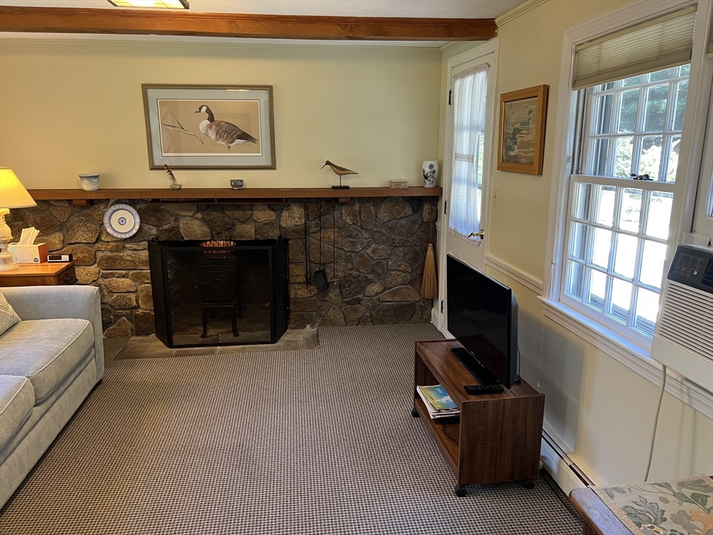 71 Greenbrook Road Hamilton, MA 01982 - Photo 17 of 33 a living room with furniture and a fireplace