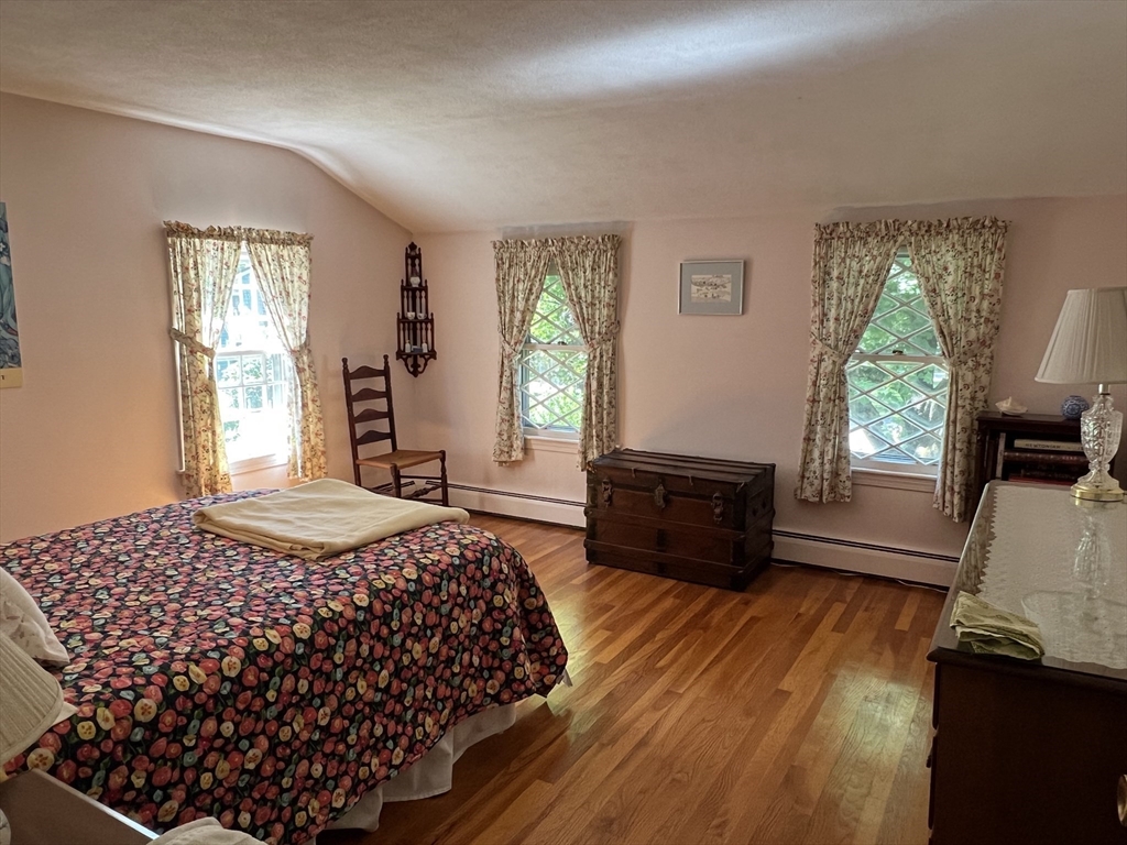 71 Greenbrook Road Hamilton, MA 01982 - Photo 21 of 33 a bedroom with a bed and wooden floor