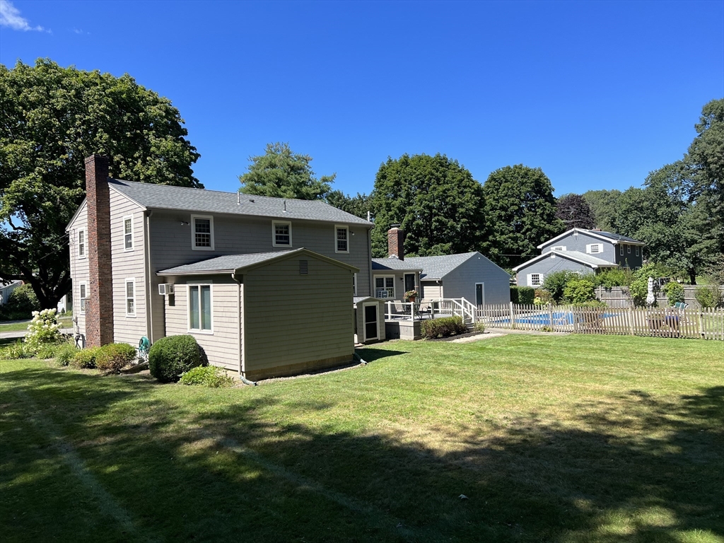 71 Greenbrook Road Hamilton, MA 01982 - Photo 3 of 33 a view of a house with a yard and a garden