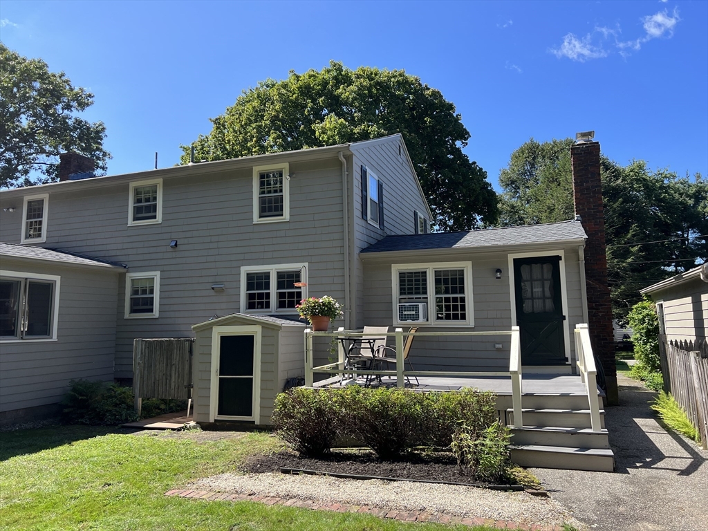 71 Greenbrook Road Hamilton, MA 01982 - Photo 5 of 33 a front view of a house with a yard