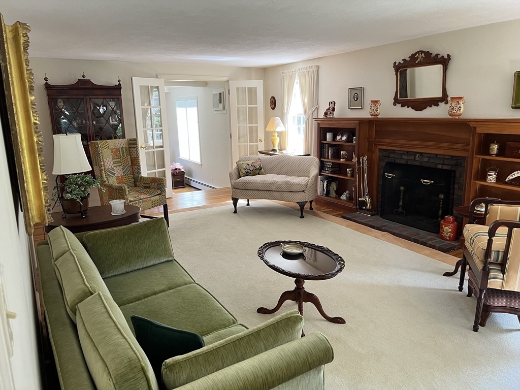 71 Greenbrook Road Hamilton, MA 01982 - Photo 8 of 33 a living room with furniture and a fireplace