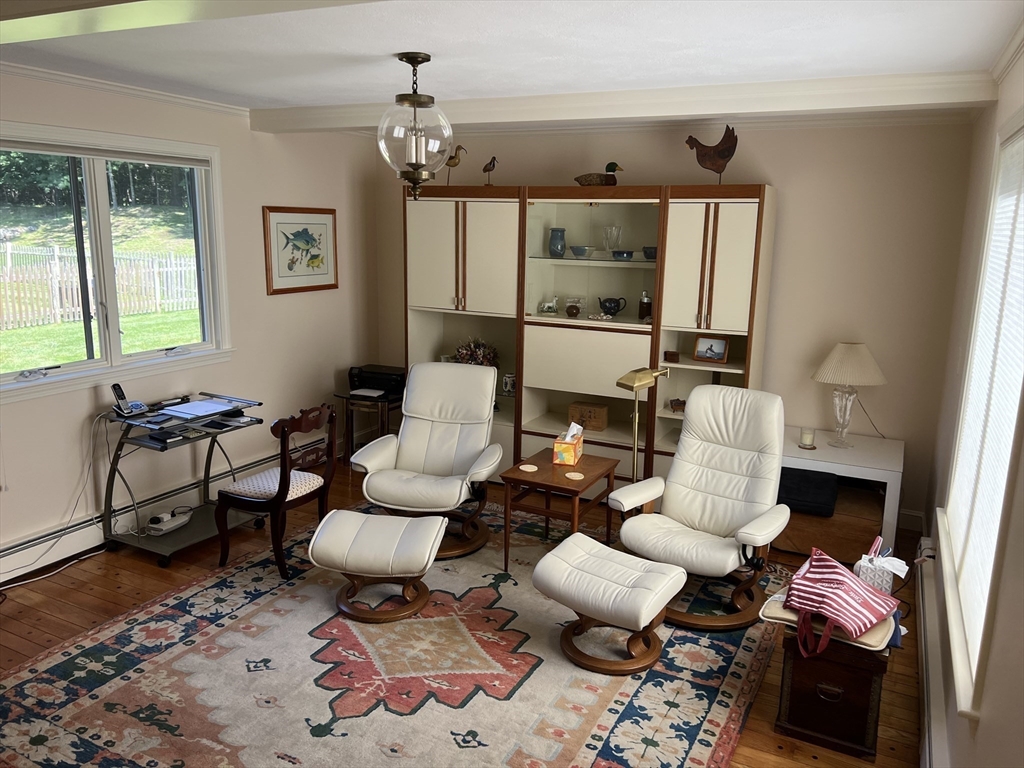 71 Greenbrook Road Hamilton, MA 01982 - Photo 9 of 33 a living room with furniture wooden floor and a chandelier