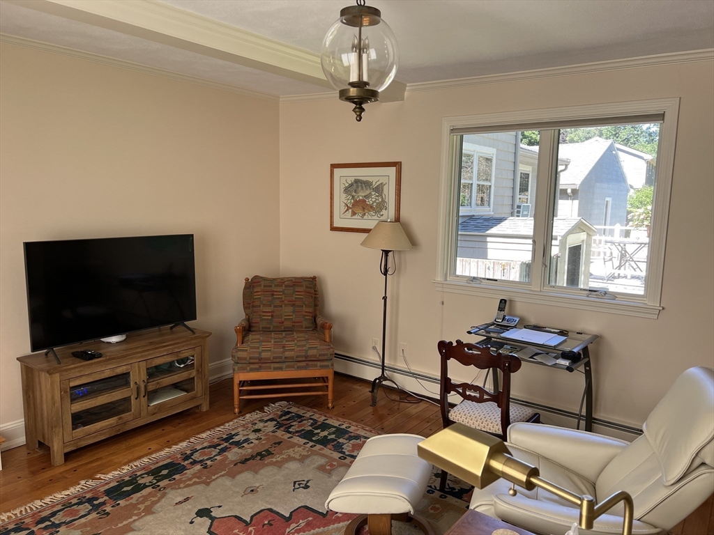 71 Greenbrook Road Hamilton, MA 01982 - Photo 10 of 33 a living room with furniture and a flat screen tv