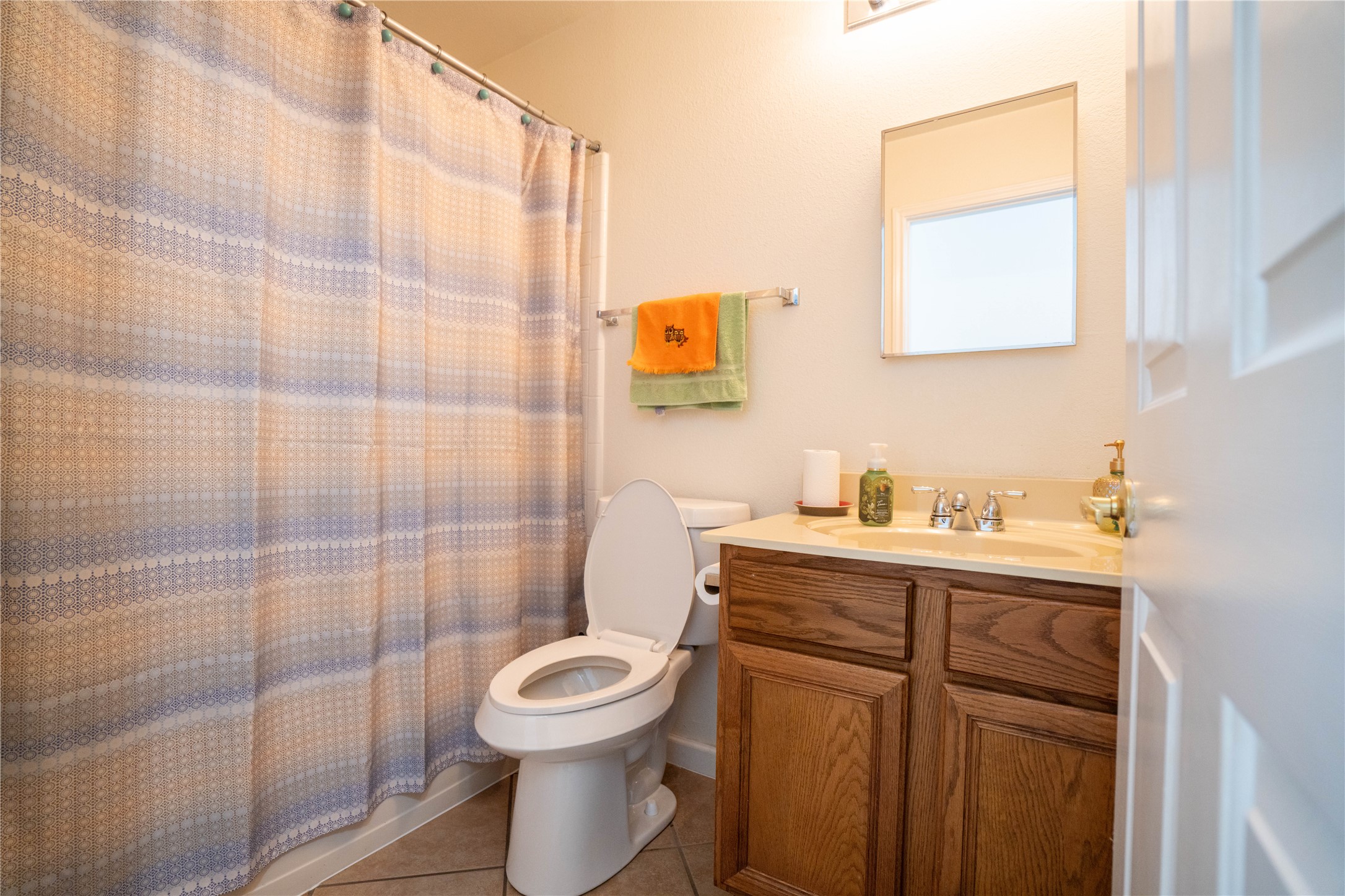 7516 Cats-Eye Lane Austin, TX 78747 - Photo 22 of 30 a bathroom with a toilet a sink and shower