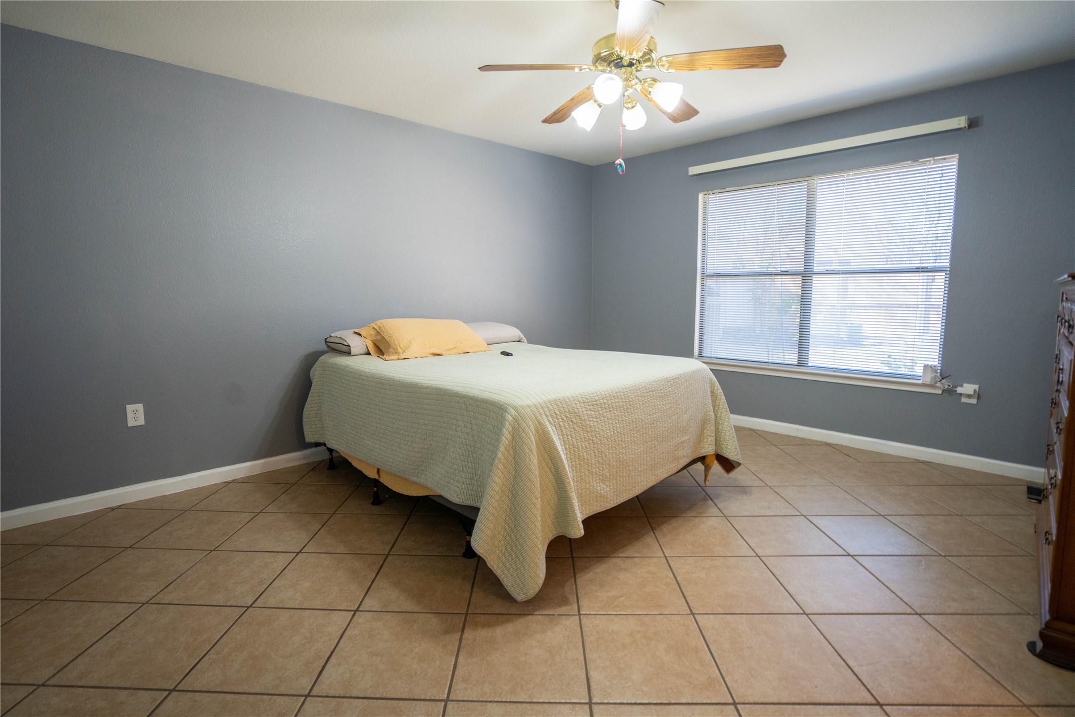 7516 Cats-Eye Lane Austin, TX 78747 - Photo 23 of 30 a bed sitting in a bedroom next to a window
