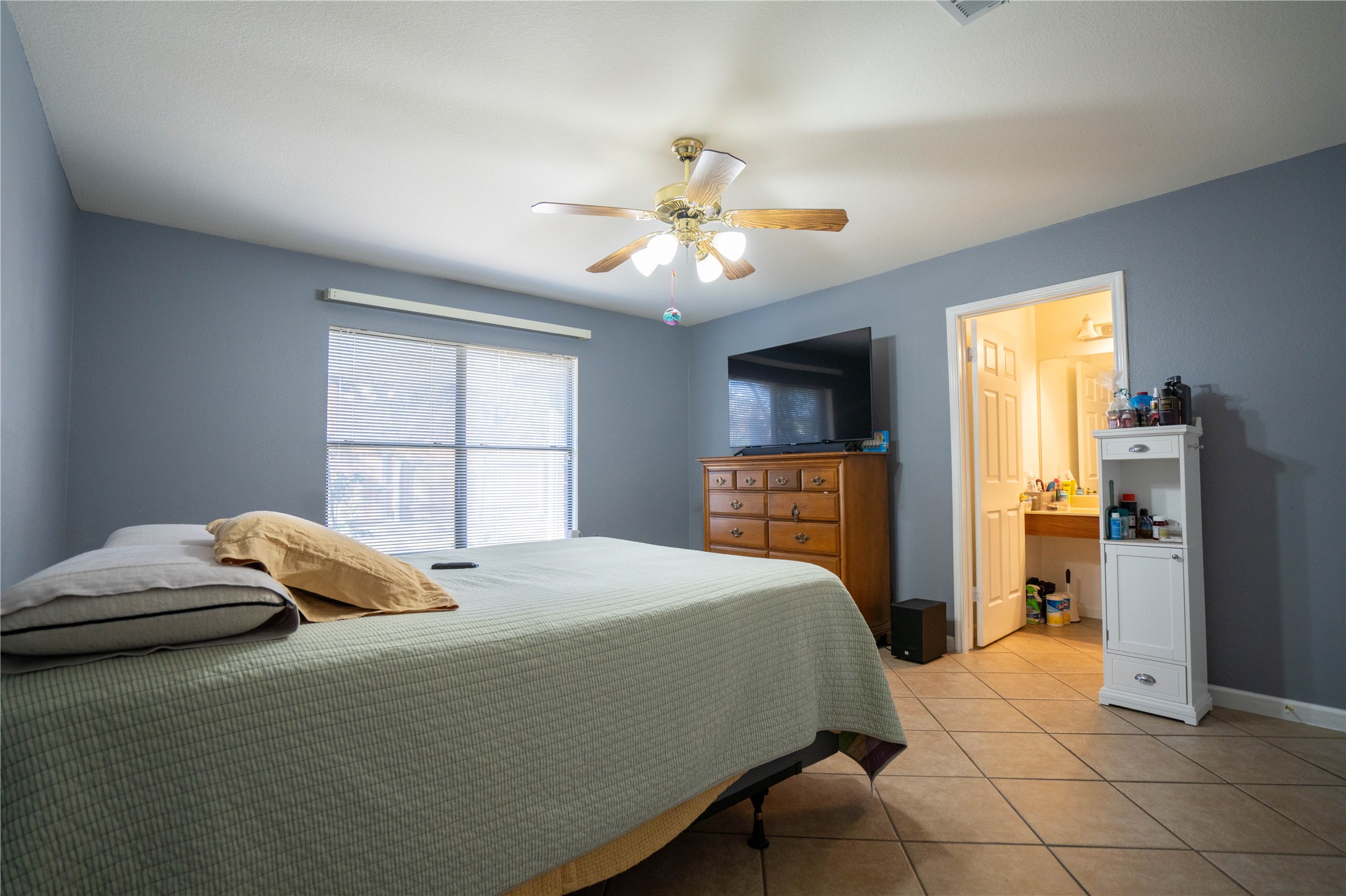 7516 Cats-Eye Lane Austin, TX 78747 - Photo 24 of 30 a bedroom with a bed and a window