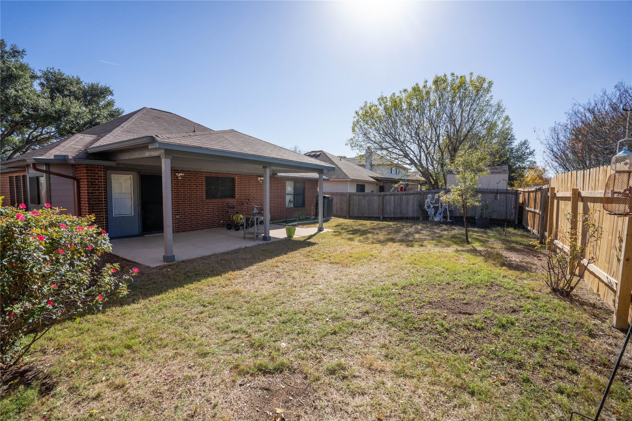 7516 Cats-Eye Lane Austin, TX 78747 - Photo 28 of 30 a view of a house with a large tree and a yard