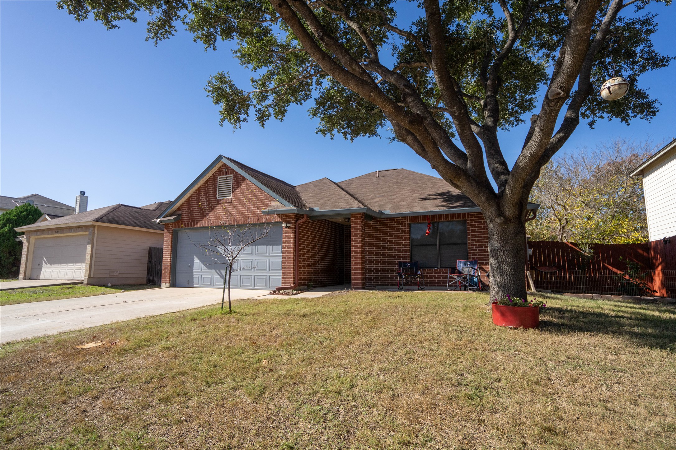 7516 Cats-Eye Lane Austin, TX 78747 - Photo 3 of 30 a house that has a tree in front of it