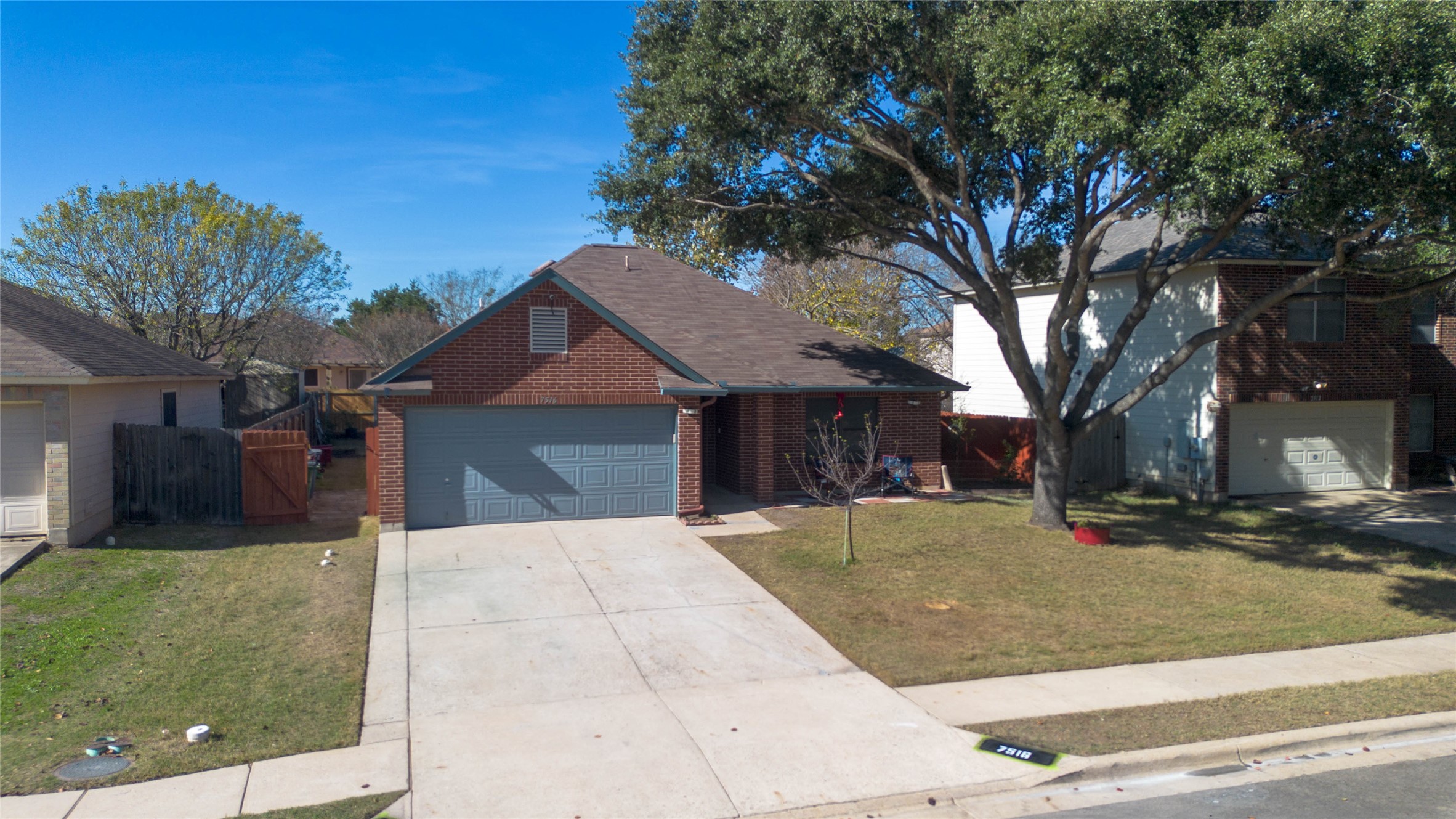 7516 Cats-Eye Lane Austin, TX 78747 - Photo 4 of 30 a front view of a house with a yard