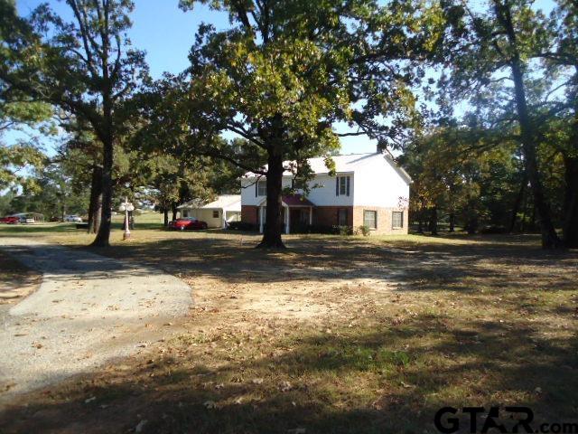 16994-c R 223 C R 223 Arp, TX 75750 - Photo 3 of 38 a view of road with large trees
