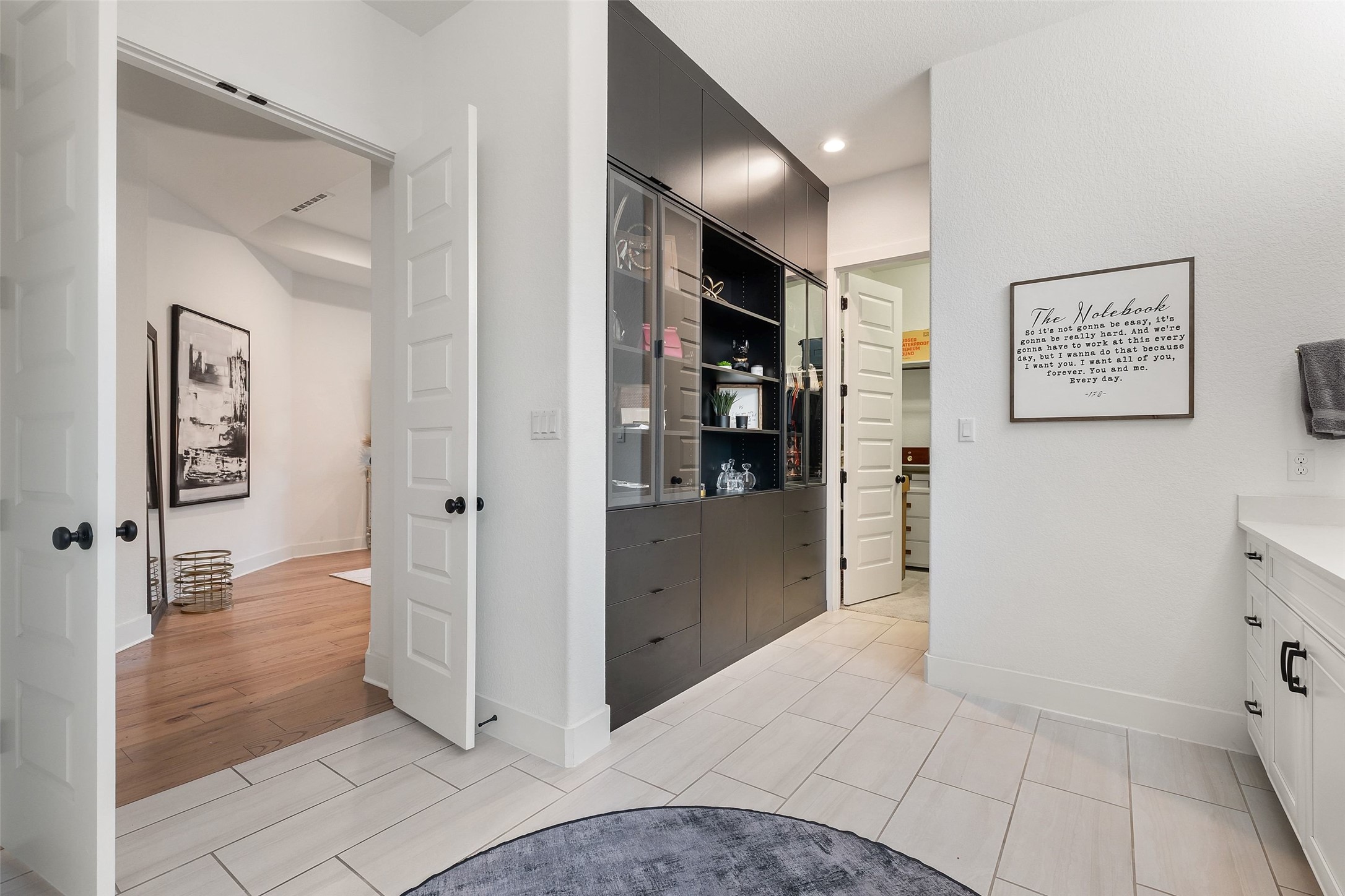 302 Lodestone Lane Austin, TX 78738 - Photo 16 of 40 Exceptional storage throughout including California Closets in the office/living room/primary bathroom plus the oversized 3 car garage with workshop area.
