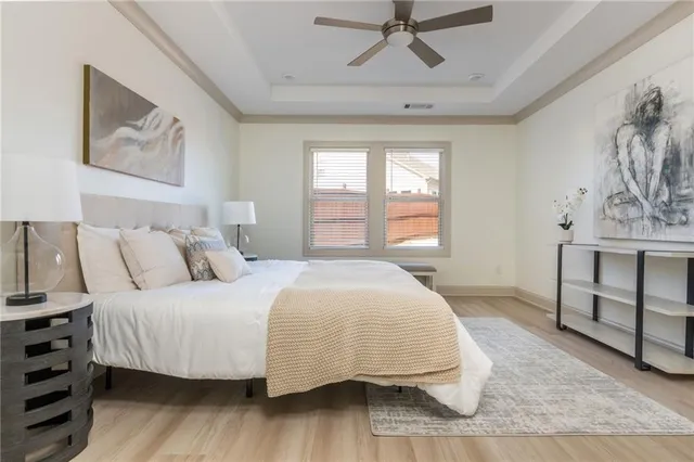 a bedroom with a bed and a lamp