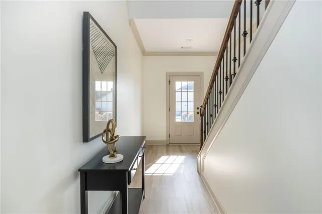 a view of a livingroom with furniture and staircase