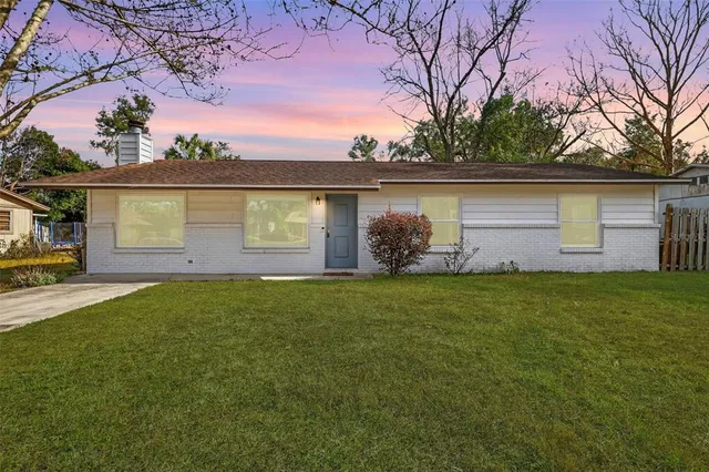 a front view of house with yard and entertaining space