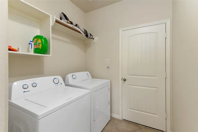 a view of an empty room with a ceiling fan