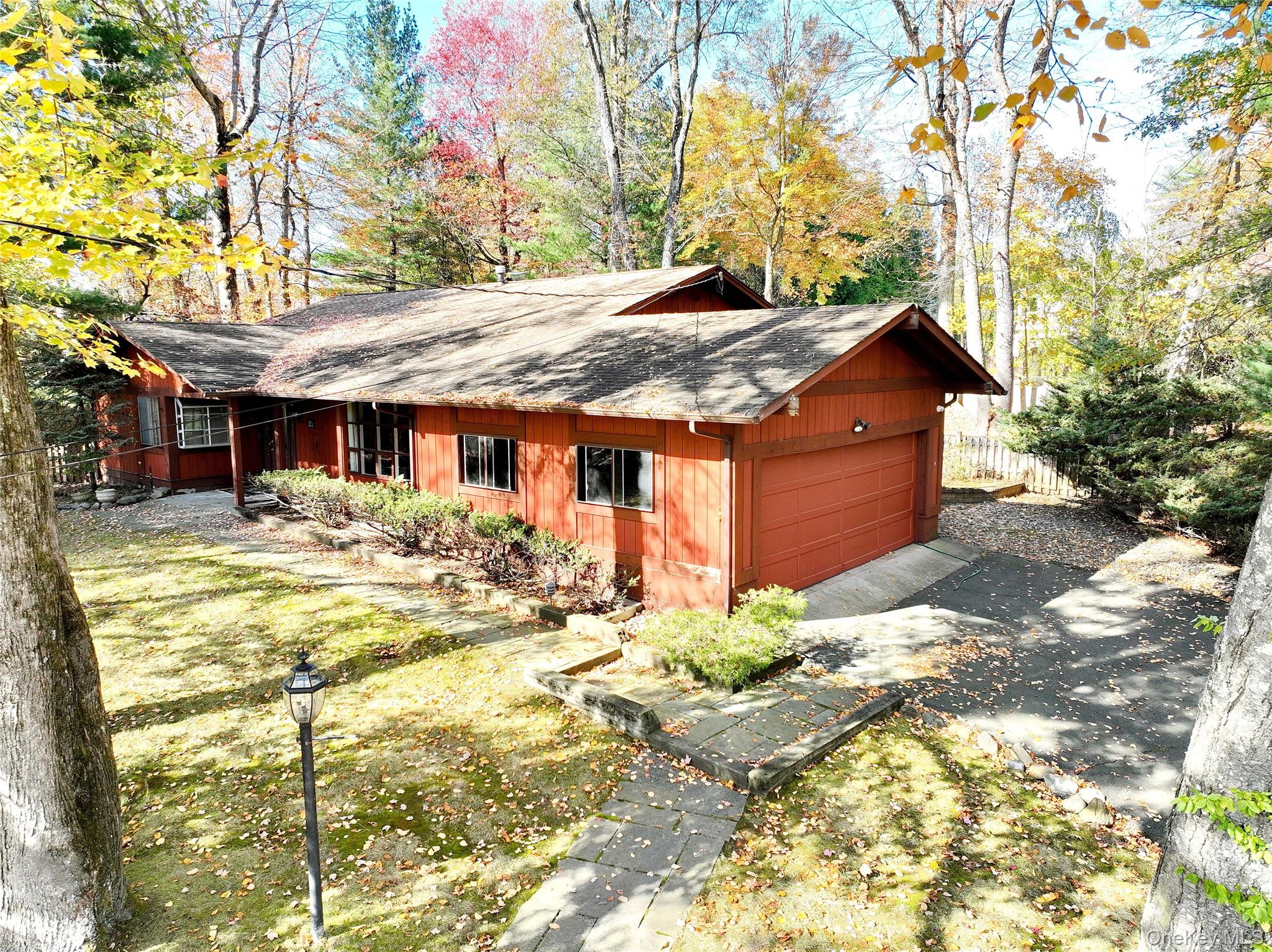 13 Lomond Avenue Spring Valley, NY 10977 - Photo 2 of 6 a backyard of a house with table and chairs under an umbrella