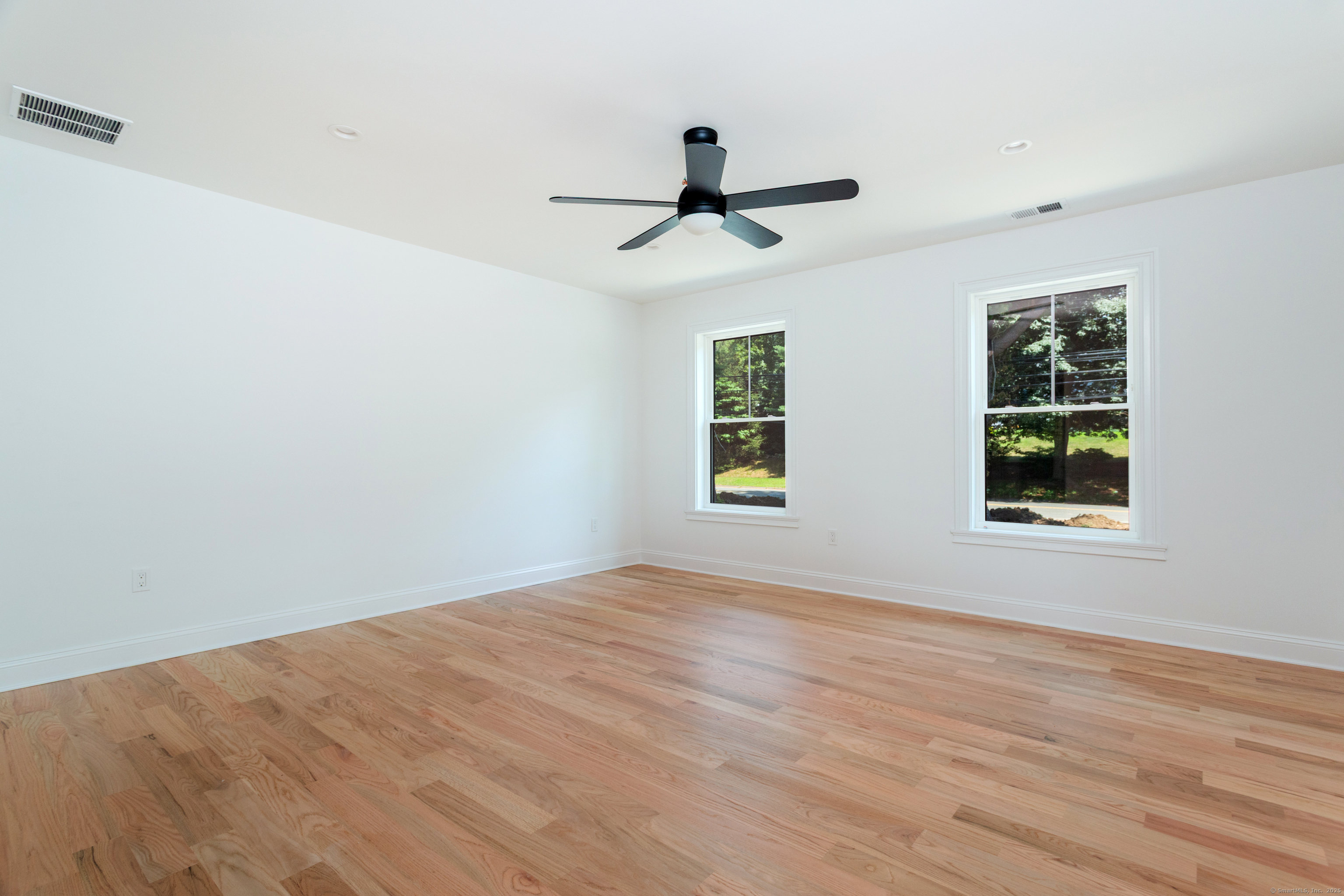 815 James Farm Road Stratford, CT 06614 - Photo 22 of 34 wooden floor in an empty room with a window