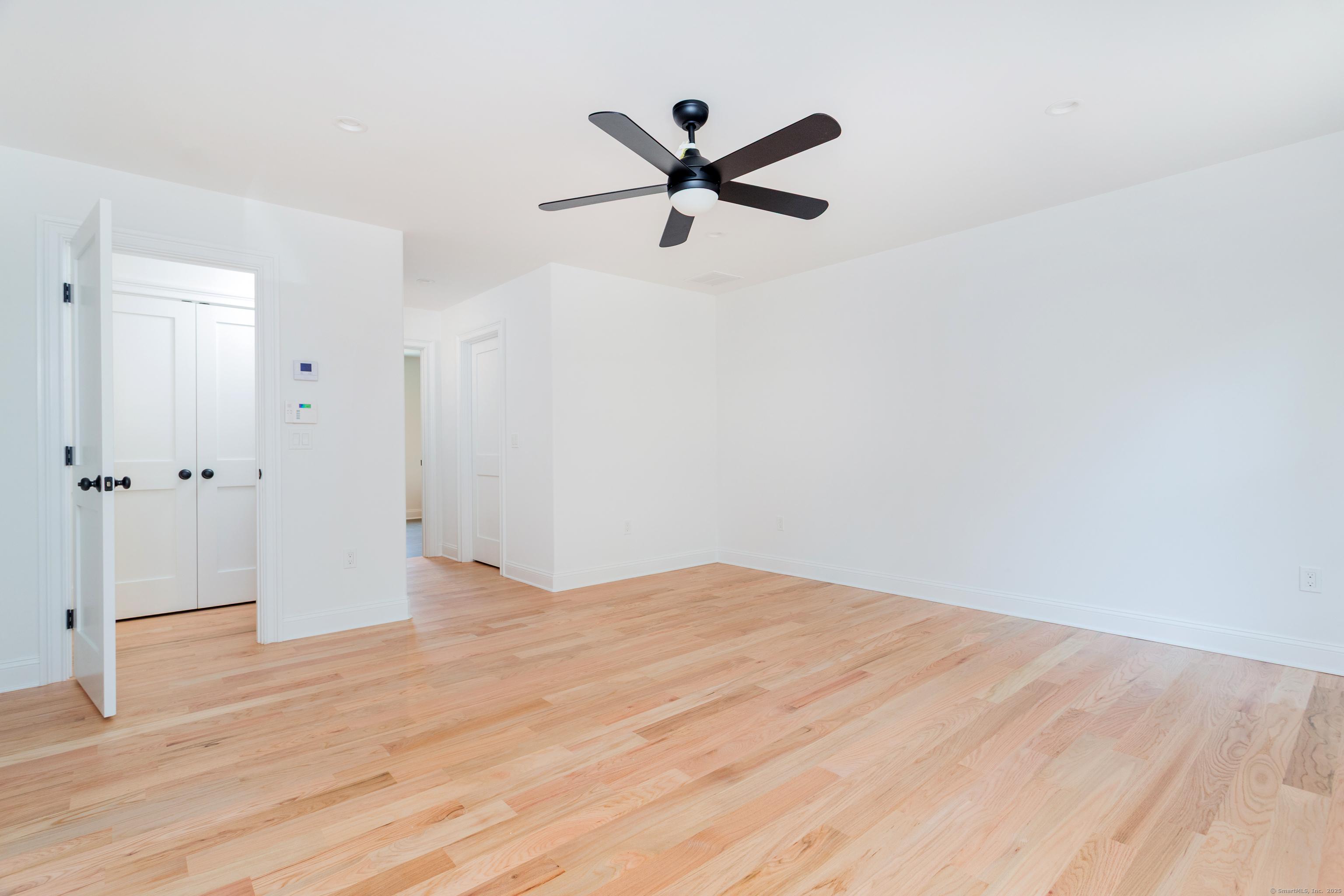 815 James Farm Road Stratford, CT 06614 - Photo 23 of 34 a view of a room with wooden floor and white walls
