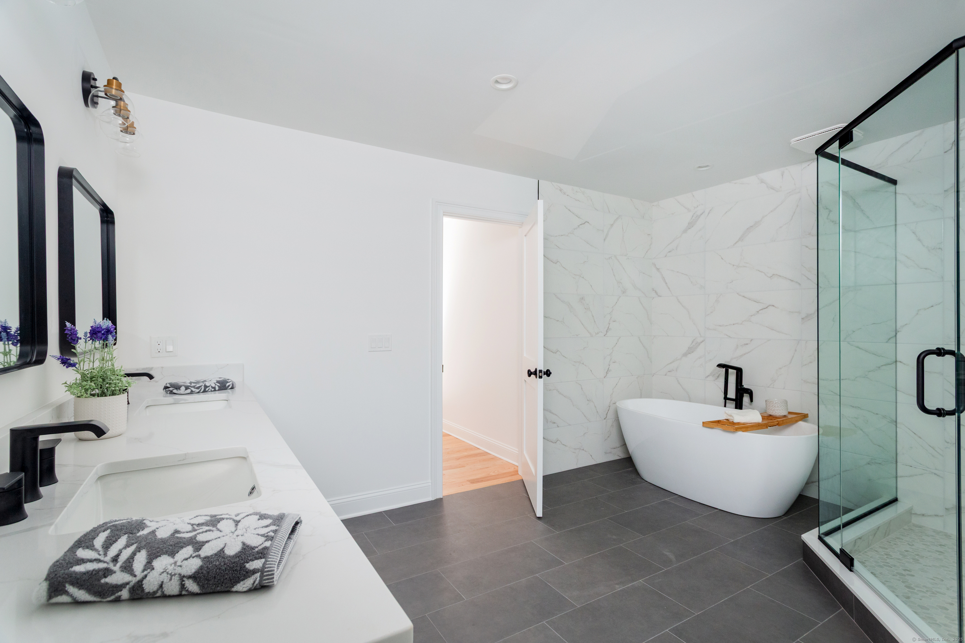 815 James Farm Road Stratford, CT 06614 - Photo 26 of 34 a bathroom with a sink mirror and a bathtub
