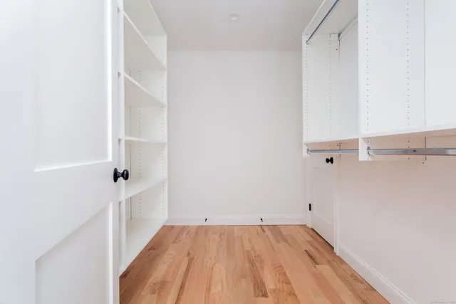 a view of a room with racks on the wall