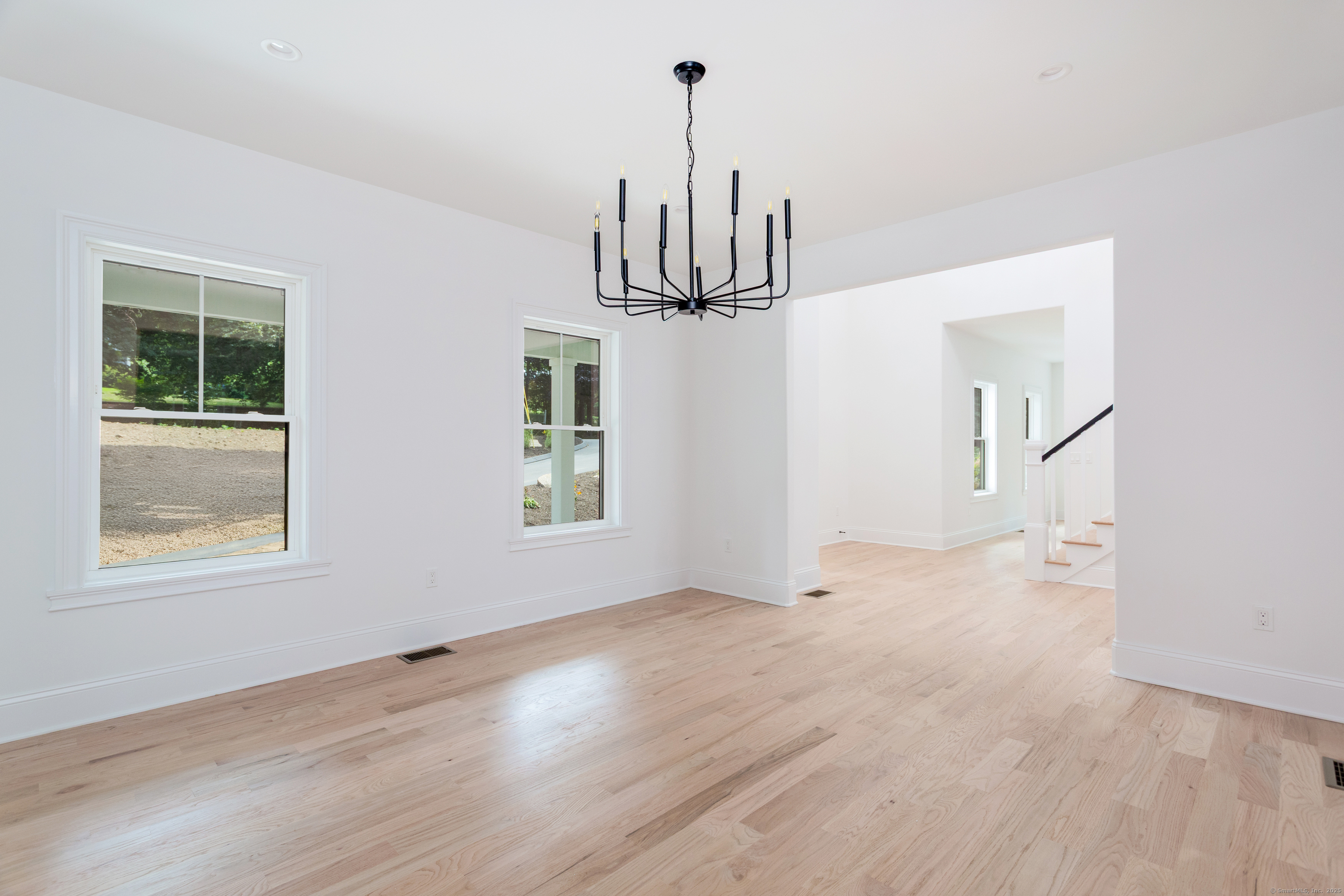 815 James Farm Road Stratford, CT 06614 - Photo 6 of 34 a view of empty room with wooden floor and window