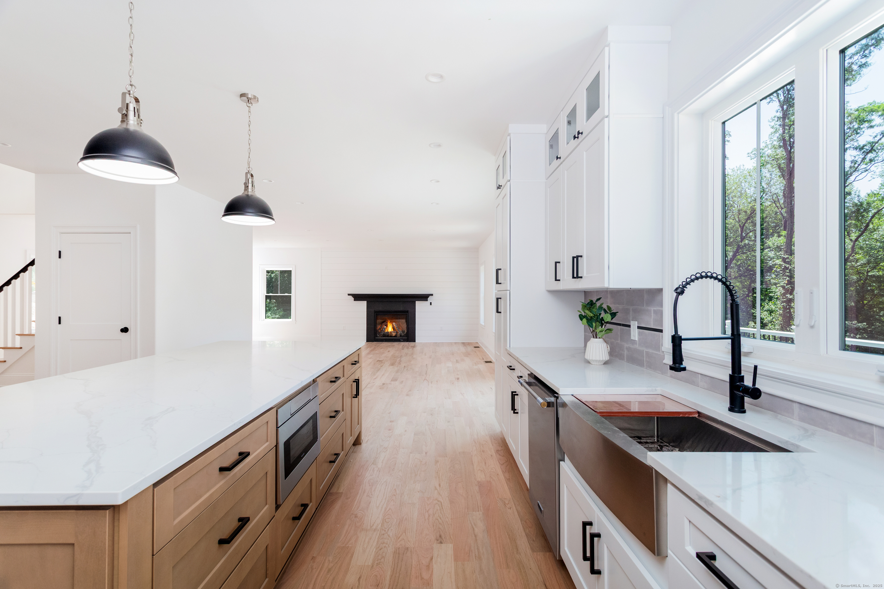 815 James Farm Road Stratford, CT 06614 - Photo 10 of 34 a kitchen with granite countertop a sink and a stove with wooden floor
