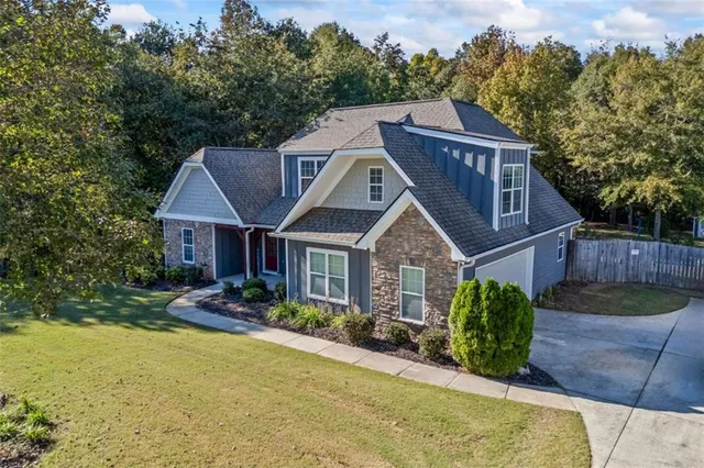a front view of a house with garden