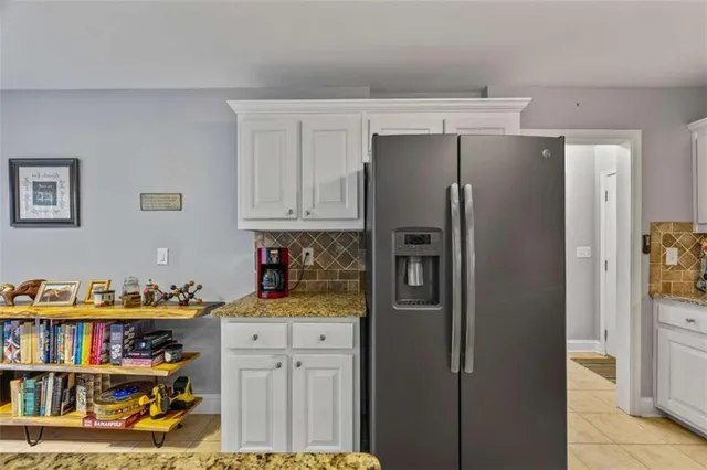 a kitchen with stainless steel appliances a refrigerator and a stove