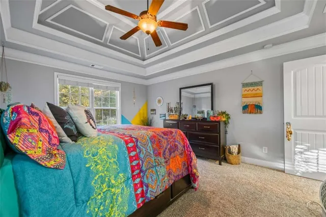 a bedroom with bed and window