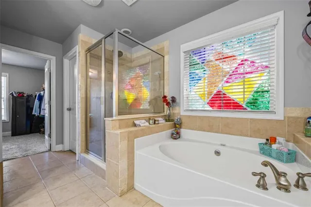 a bathroom with a bathtub and a sink