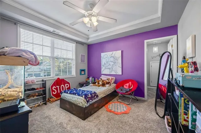 a bedroom with furniture and a chandelier