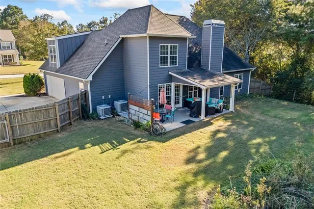 a view of a house with roof deck front of house