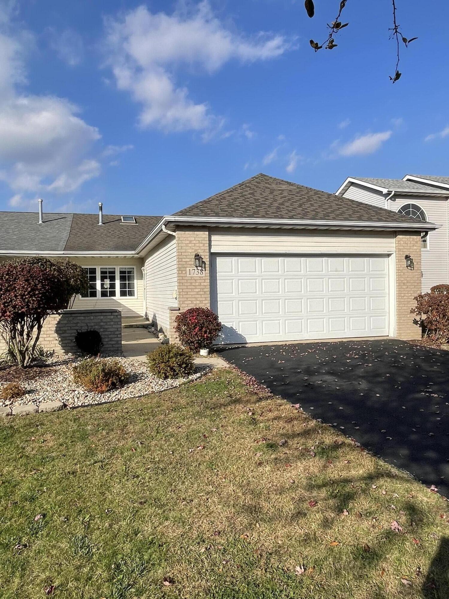 1738 Beech Drive Crown Point, IN 46307 - Photo 1 of 16 a front view of a house with a yard