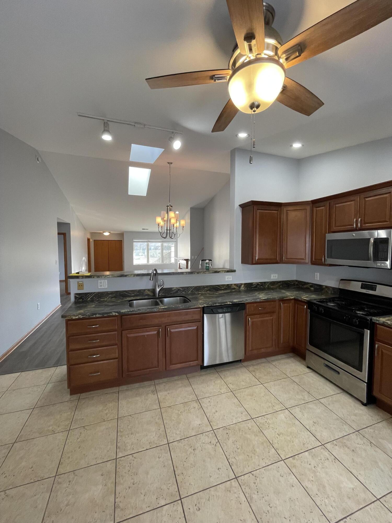 1738 Beech Drive Crown Point, IN 46307 - Photo 6 of 16 a large kitchen with a large counter space a sink and appliances