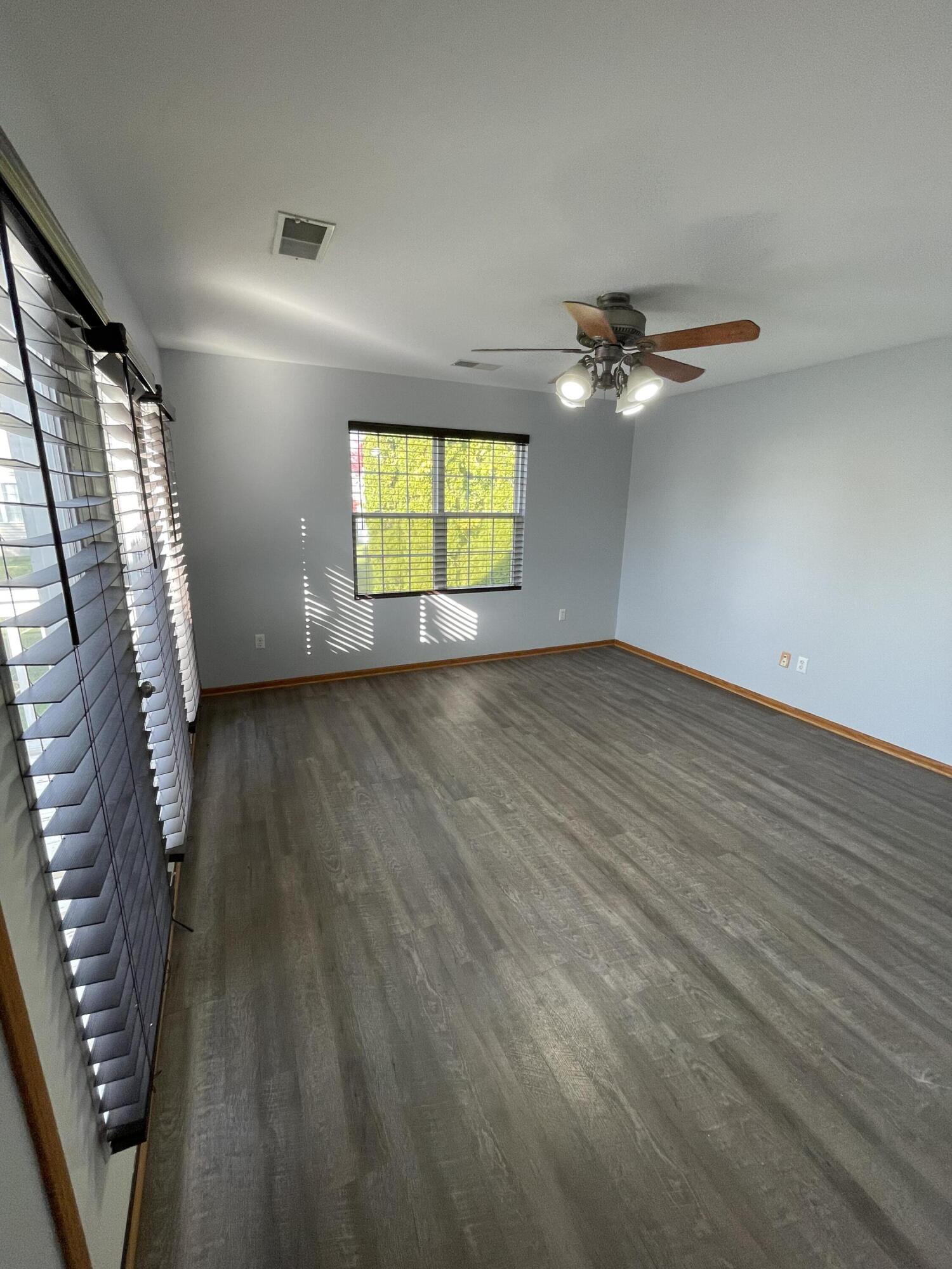 1738 Beech Drive Crown Point, IN 46307 - Photo 8 of 16 wooden floor in an empty room with a window