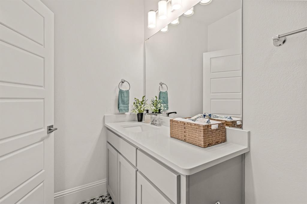 1616 Prairie Ridge Road Fort Worth, TX 76008 - Photo 31 of 40 a bathroom with a sink and a mirror