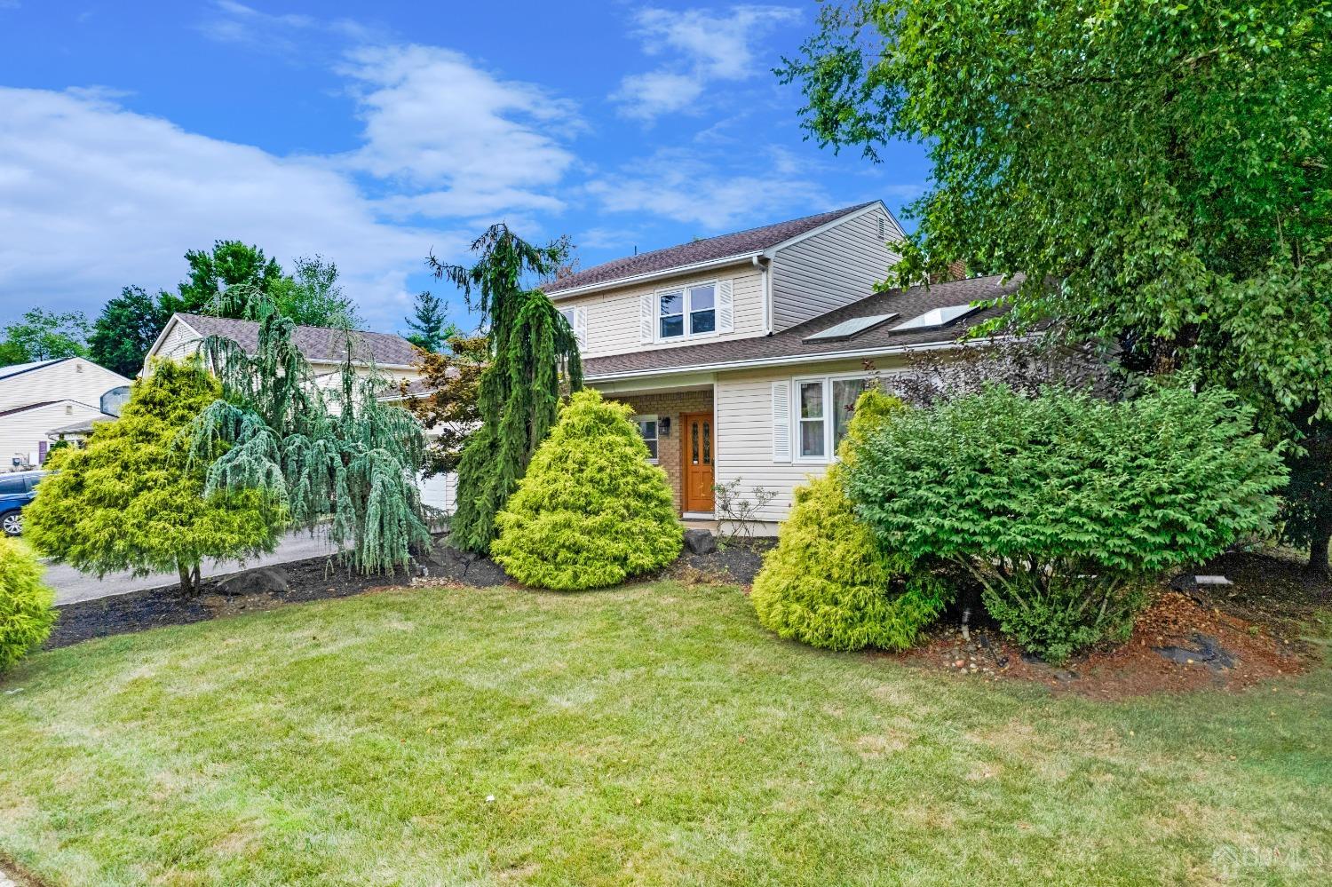 41 Laura Avenue Edison, NJ 08820 - Photo 2 of 45 front view of a house with a garden