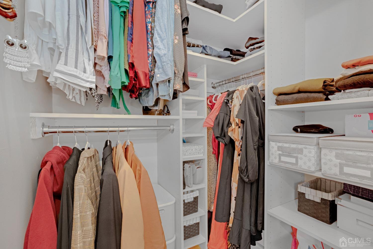 41 Laura Avenue Edison, NJ 08820 - Photo 22 of 45 a view of walk in closet with clothes and shoes