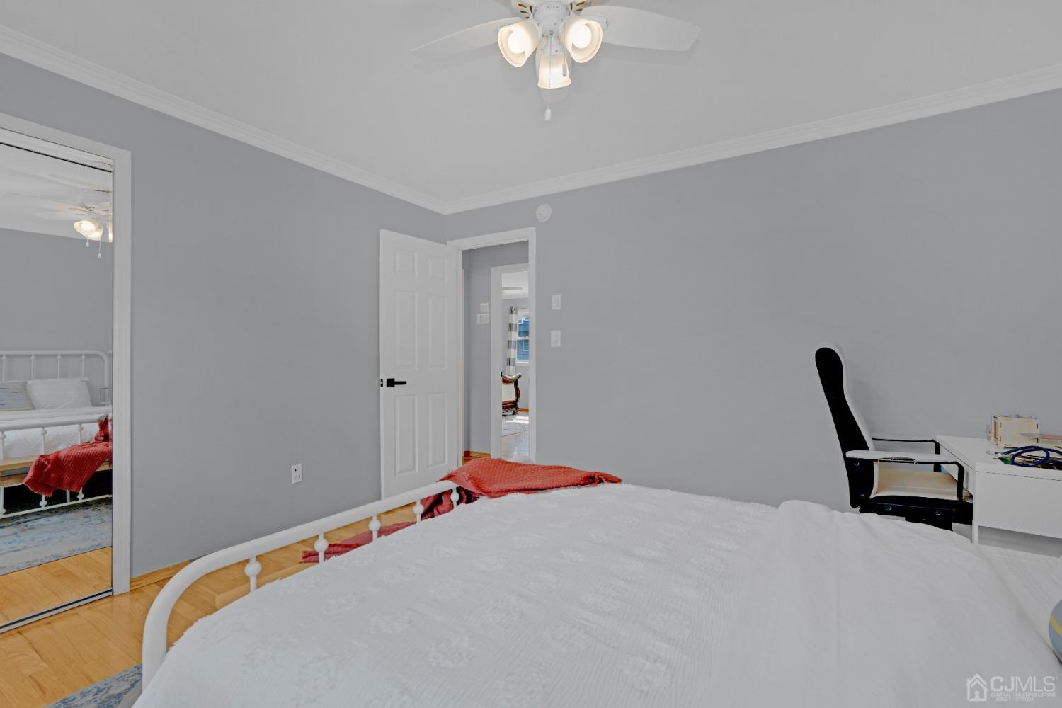 41 Laura Avenue Edison, NJ 08820 - Photo 24 of 45 a bedroom with a bed and a chandelier