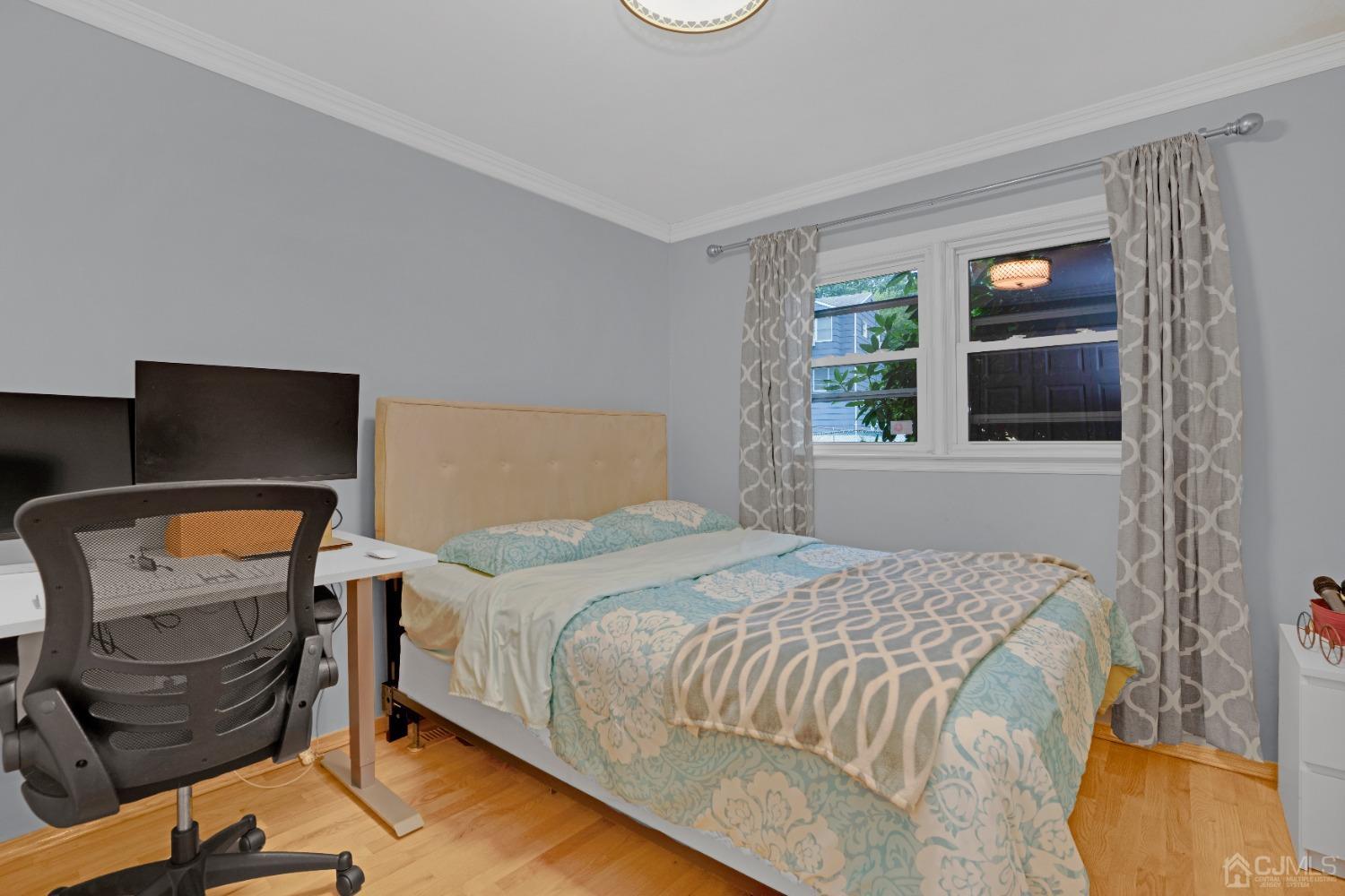 41 Laura Avenue Edison, NJ 08820 - Photo 28 of 45 a bedroom with a bed and wooden floor