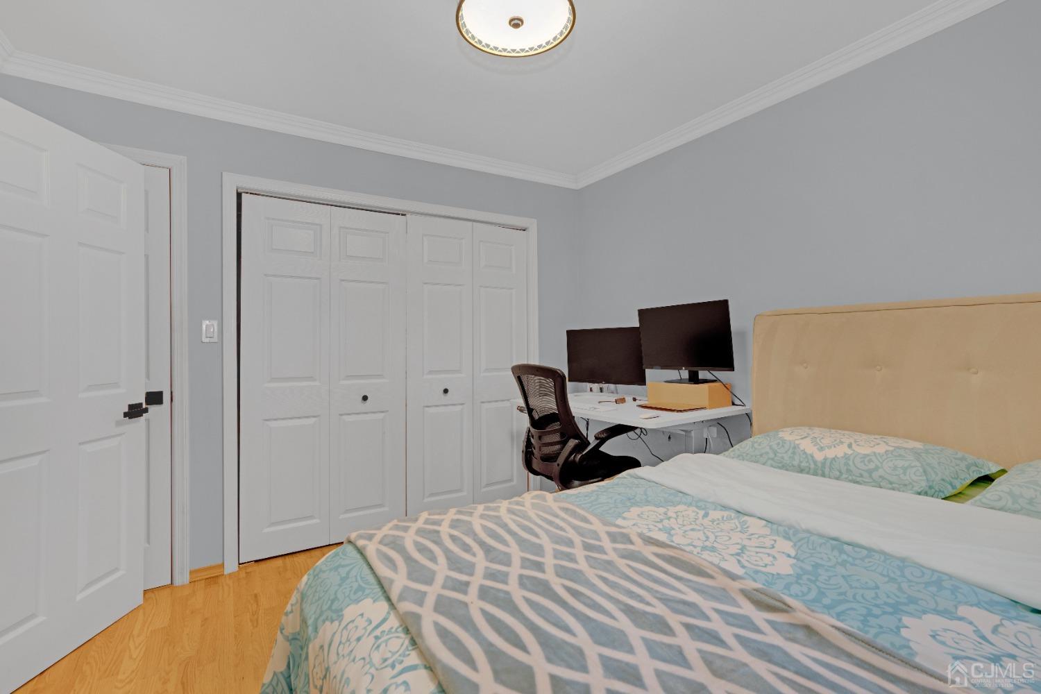 41 Laura Avenue Edison, NJ 08820 - Photo 29 of 45 a bedroom with a bed and a television