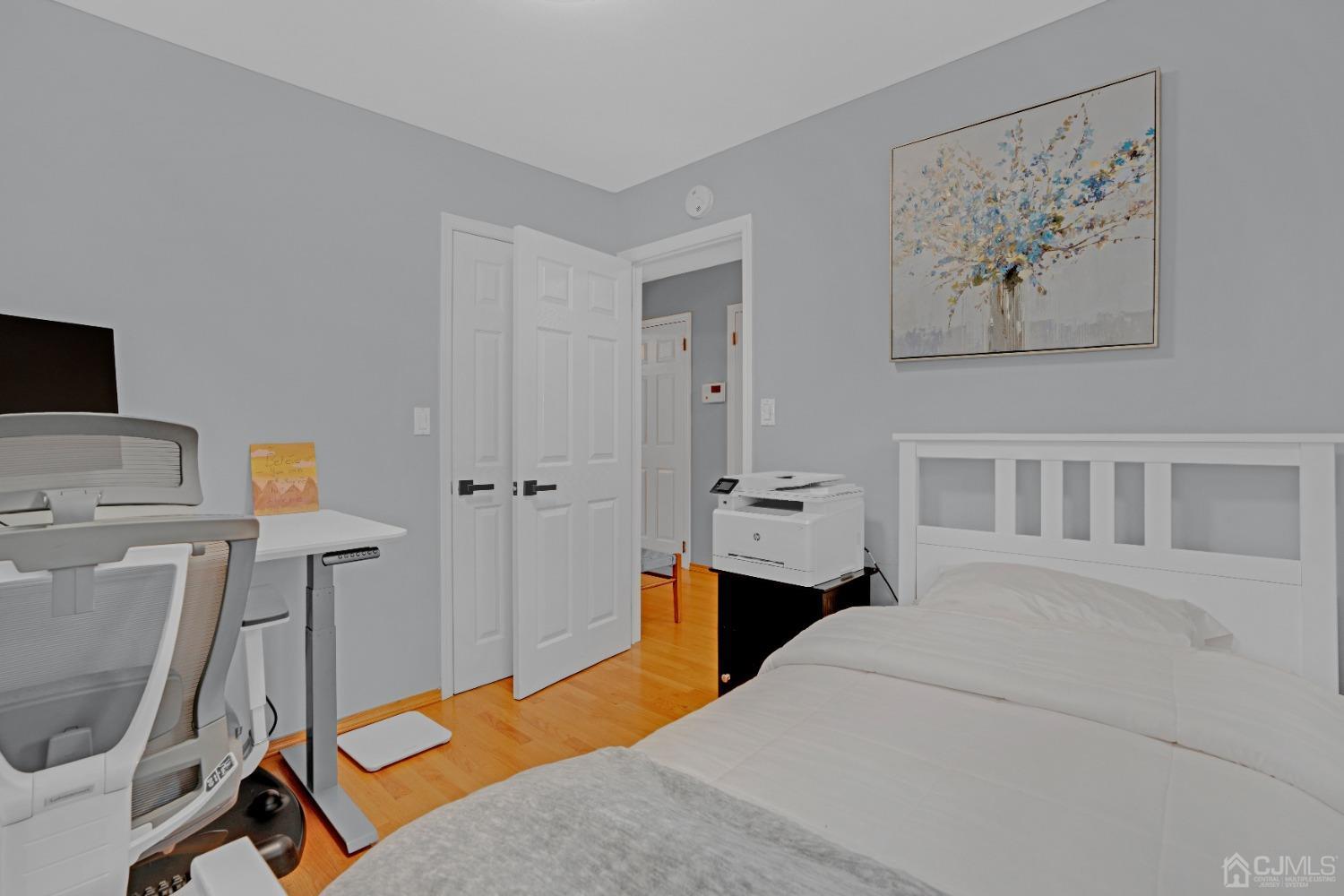 41 Laura Avenue Edison, NJ 08820 - Photo 30 of 45 a bedroom with a bed and a desk in it