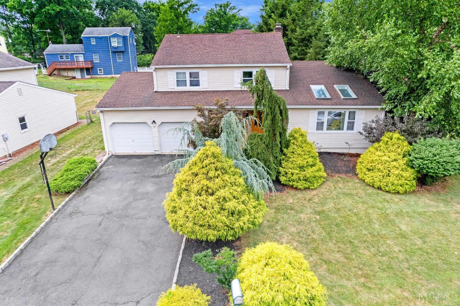 41 Laura Avenue Edison, NJ 08820 - Photo 3 of 45 a aerial view of a house with a yard and potted plants