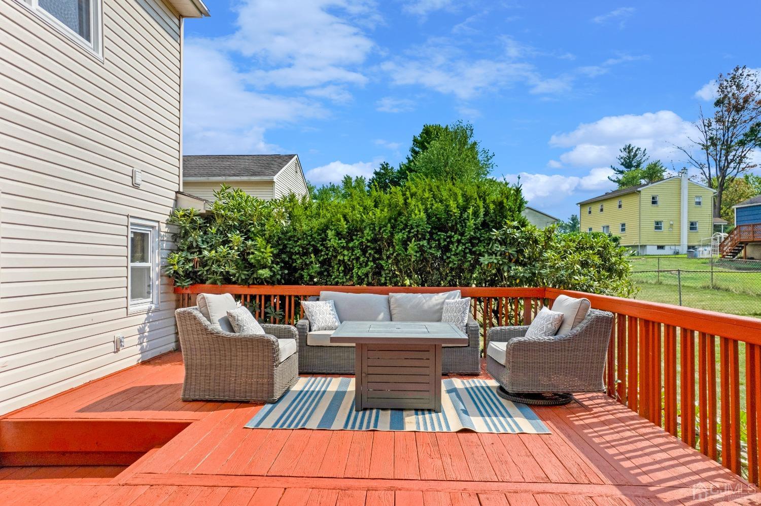 41 Laura Avenue Edison, NJ 08820 - Photo 37 of 45 a view of a patio with couches and table and chairs and potted plants