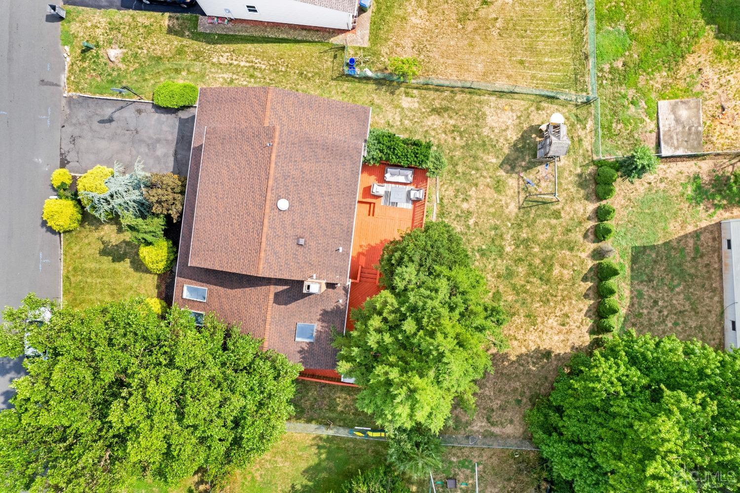 41 Laura Avenue Edison, NJ 08820 - Photo 44 of 45 a aerial view of a house with a yard and garden space