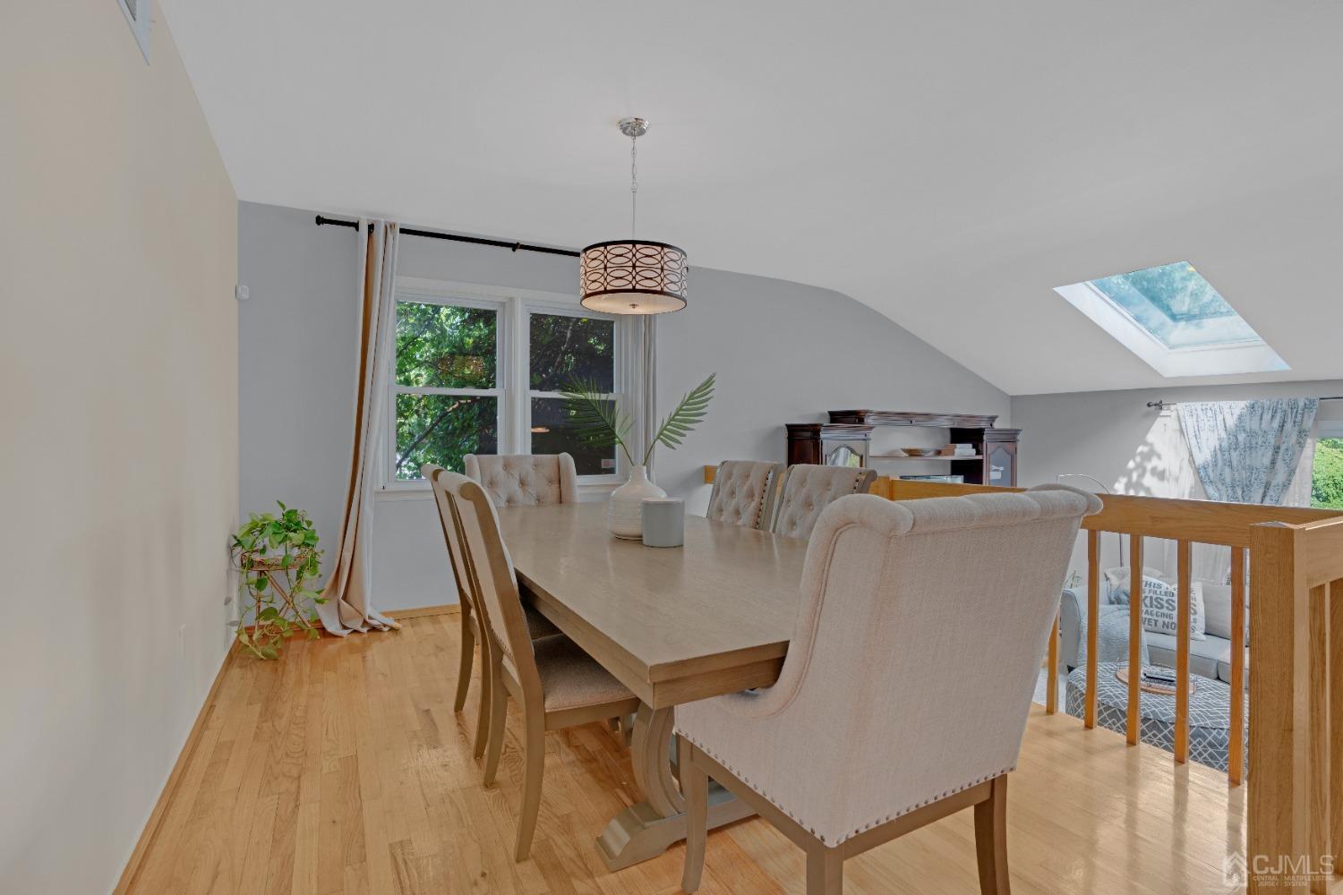 41 Laura Avenue Edison, NJ 08820 - Photo 10 of 45 a dining room with furniture a chandelier and wooden floor