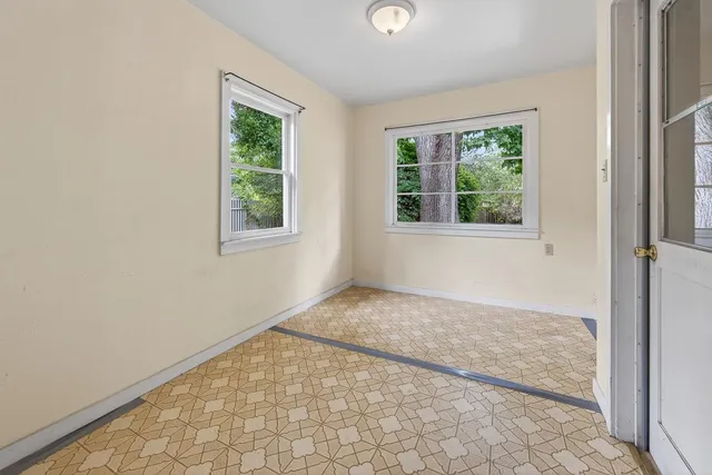 an empty room with windows