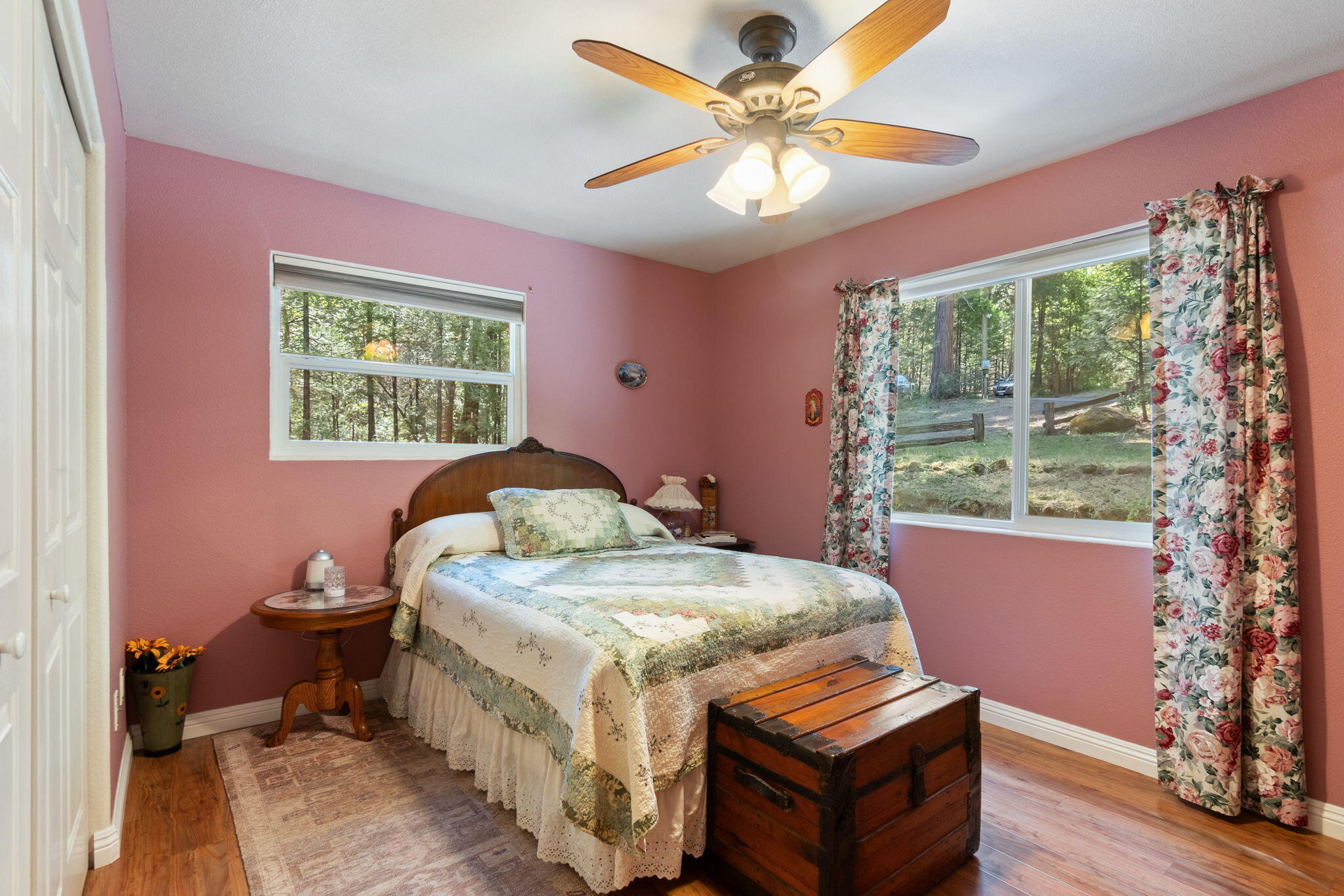 30303 Oak Run To Fern Road Whitmore, CA 96096 - Photo 30 of 75 a bedroom with a bed and a chandelier