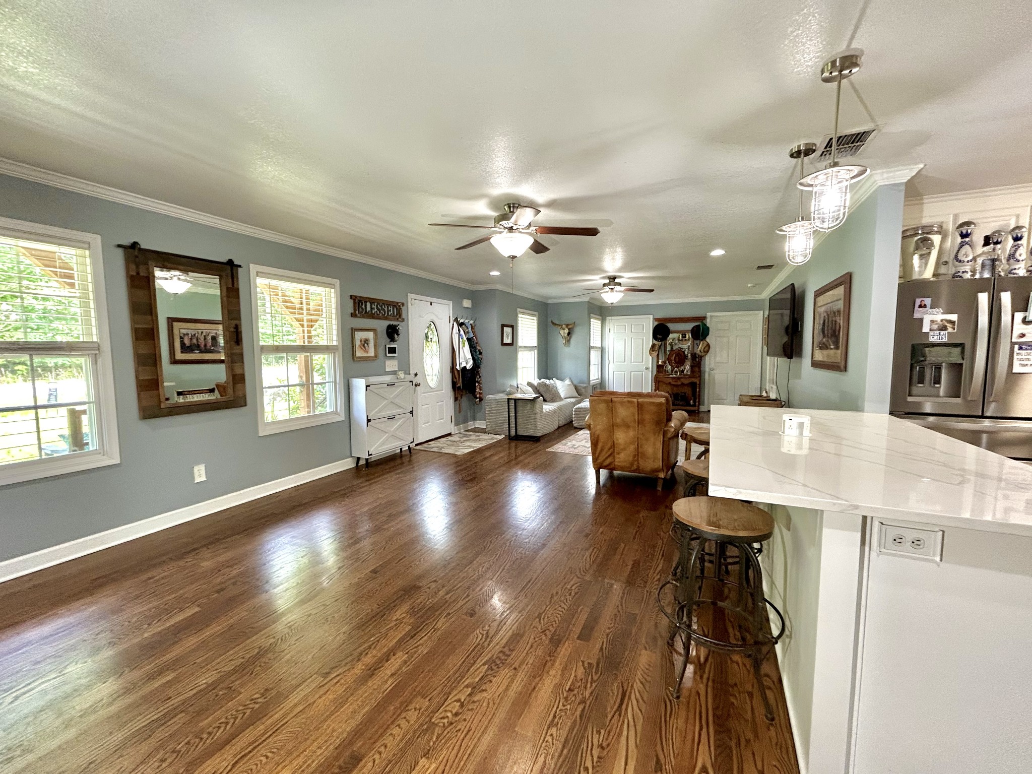 1198 Ed Sanders Road Lynchburg, TN 37352 - Photo 9 of 36 a view of a livingroom with furniture a ceiling fan and window