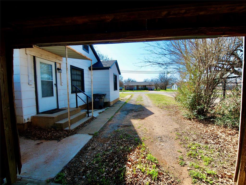 1327 Old Jacksboro Road Graham, TX 76450 - Photo 29 of 33 a view of a backyard of a house
